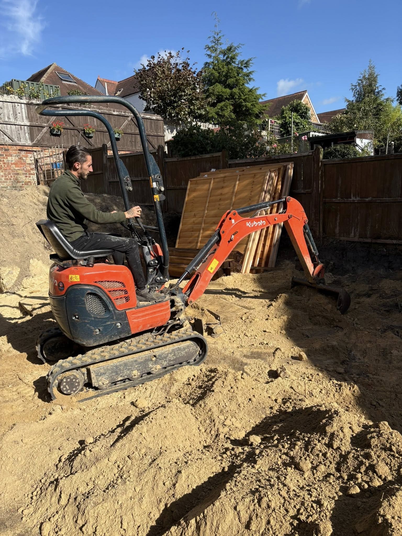 Complete garden transformation with retaining wall and beds
